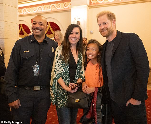 The father-of-two, dressed in a smart blazer and jeans, smiled for photographs with attendees at the event