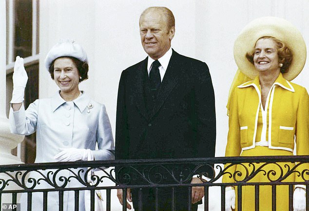 Queen Elizabeth waves from the balcony of the White House alongside President Gerald Ford and First Lady Betty Ford in 1976