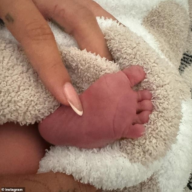 JUSTIN & HAILEY BIEBER: But all they will show us of newborn son Jack is one of his tiny feet