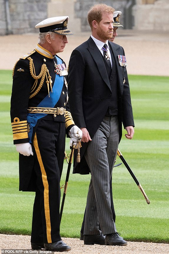 Britain's King Charles III (L) walks with his son Britain's Prince Harry, Duke of Sussex as they arrive at St George's Chapel inside Windsor Castle on September 19, 2022, ahead of the Committal Service for Britain's Queen Elizabeth II. Monday's committal service is expected to be attended by at least 800 people, most of whom will not have been at the earlier State Funeral at Westminster Abbey. (Photo by David Rose / POOL / AFP) (Photo by DAVID ROSE/POOL/AFP via Getty Images)