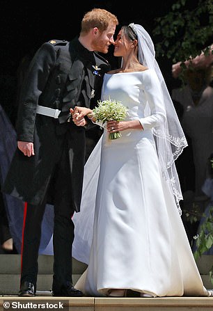 'Okay, let's kiss,' a lip reader suggested Meghan said on the steps of the chapel