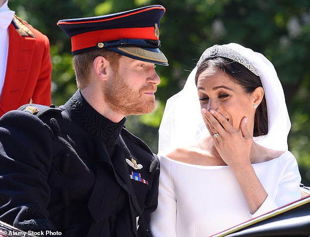 As the Duke and Duchess of Sussex travelled through Windsor in a horse-drawn carriage, Meghan turned to Harry and seemingly said, 'Oh f***!'