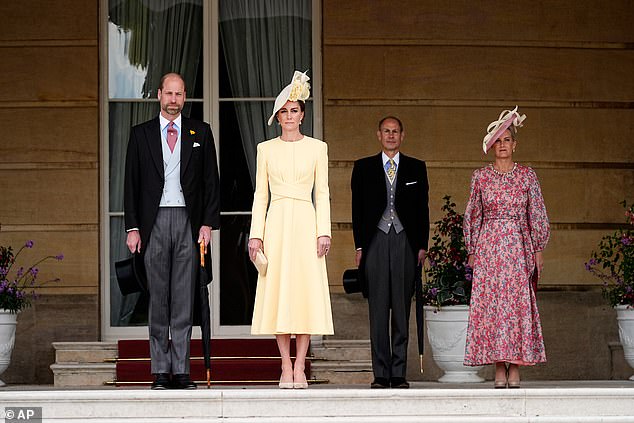 William and Kate (pictured yesterday at the start of a Royal Garden Party at Buckingham Palace) were recognised for their efforts in addressing homelessness and early years development in children
