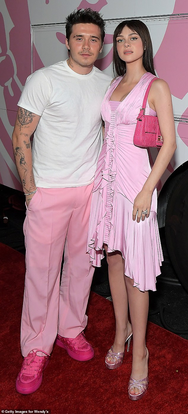 Pictures of Nicola Peltz and Brooklyn Beckham at a Wendy's bash in matching pink outfits went viral just months after their £3million wedding