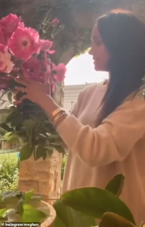Meghan Markle, 43, has recently filled her personal Instagram account with all things nature - from strawberry picking to flower arranging (pictured)