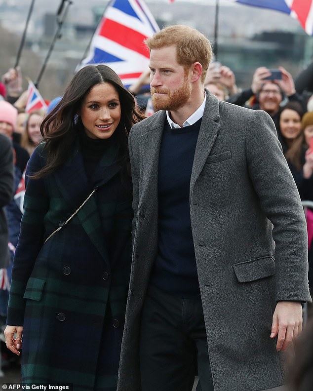 Harry and Meghan during a royal walkabout in Edinburgh. Meghan's former friend Gina was allegedly 'body-blocked' from talking to her