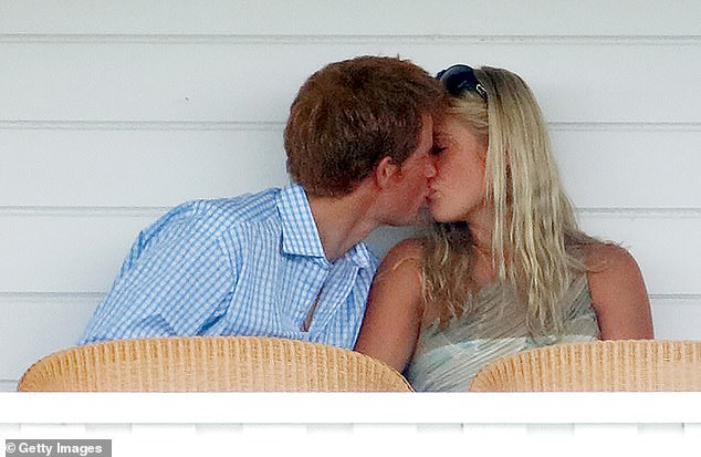 Harry and Chelsy kiss while sitting in the Royal Box as they attend the Cartier International Polo Match in July 2006