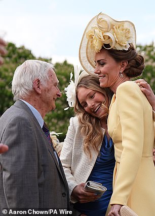 The mother-of-three, who hosted the garden party alongside her husband Prince William, shared an emotional hug with Steven Frank before the pair caught up. Pictured, Kate hugging one of Mr Frank's granddaughters