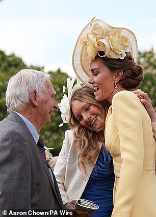 The mother-of-three, who hosted the garden party alongside her husband Prince William, shared an emotional hug with Steven Frank before the pair caught up. Pictured, Kate hugging one of Mr Frank's granddaughters