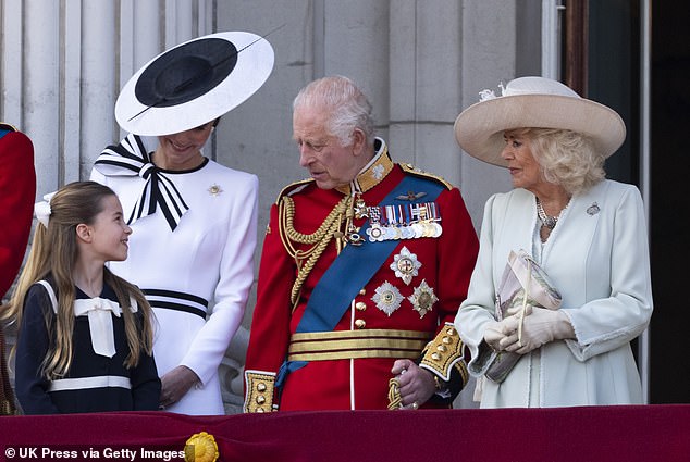 Charlotte chatting with her grandfather during Trooping the Colour. According to royal author Ingrid Seward, Charles has a 'very nice relationship with his granddaughter'