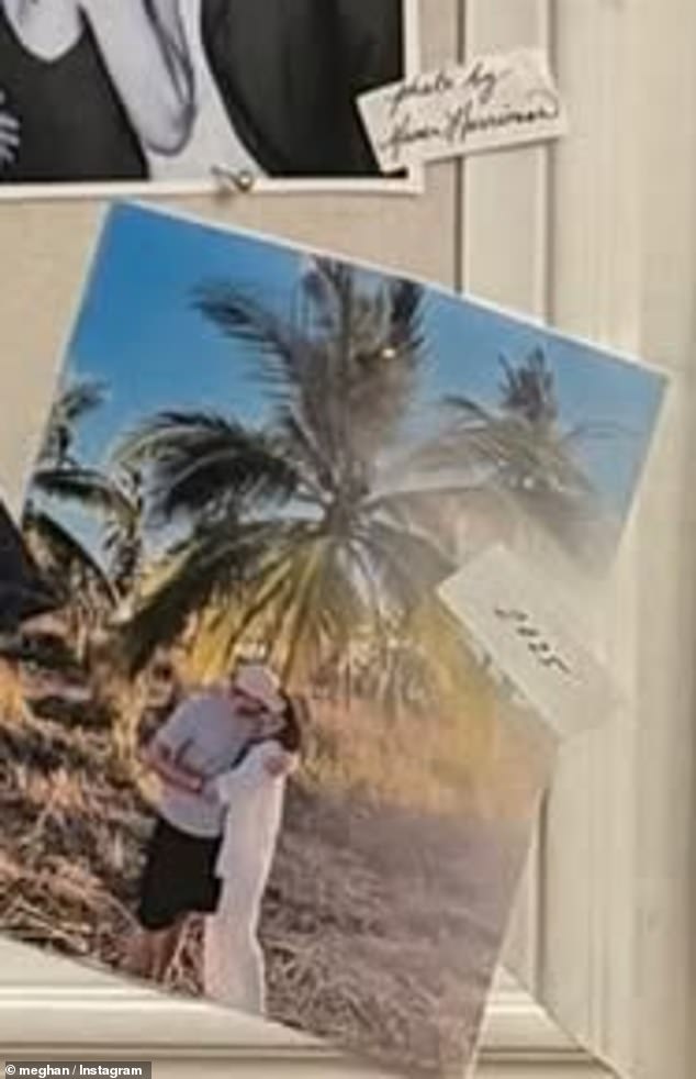 One of the most recent photos tacked on to the board is a sun-soaked snap of Harry and Meghan sharing a sweet kiss while posing in front of palm trees during what appears to be the couple's most recent getaway to Mexico with their children