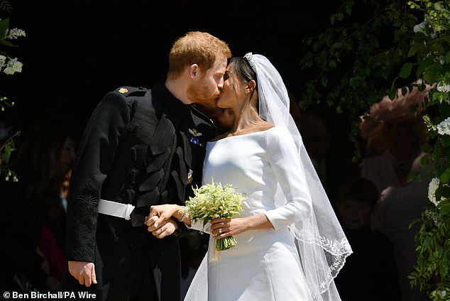 Prince Harry and Meghan Markle kissing as they leave St George's Chapel in Windsor Castle after their wedding