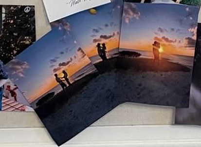 A group of three images showed Harry and Meghan's silhouettes, blacked out by the setting sun behind them, as they came together for a kiss