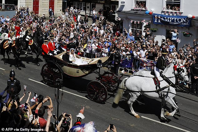 Meghan reportedly said 'Oh f***' during a carriage ride through crowds in Windsor moments after the wedding