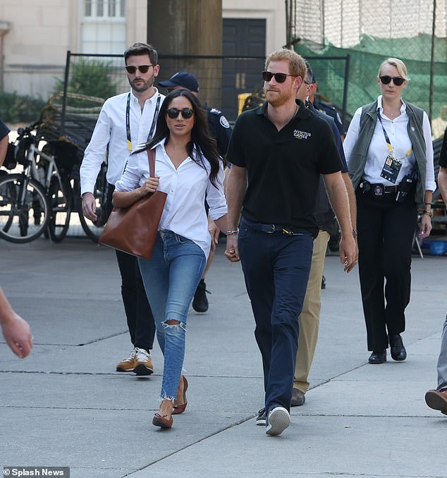 Jason Knauf (left) follows Prince Harry and Meghan Markle at the Invictus Games in Toronto in 2017. He started working for William and Catherine as the chief executive of their Royal Foundation in 2019