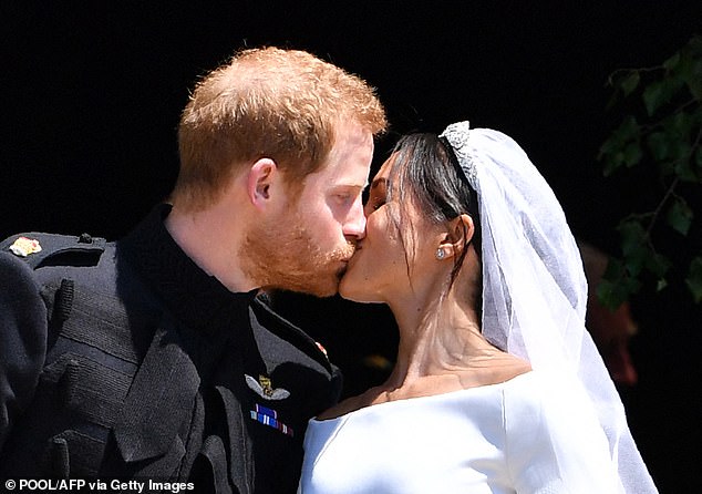 According to lip reader Larry Wenig, Meghan said under her breath: 'Okay, let's kiss'