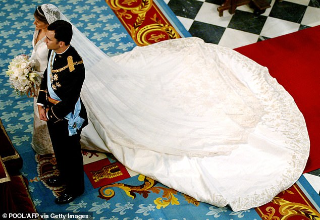 Letizia captivated guests in an exquisite Manuel Pertegaz gown, complemented by a veil gifted by her fiancé