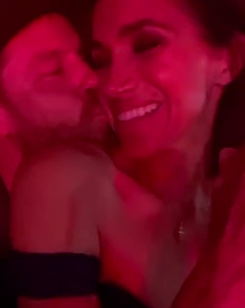 In one sweet clip, Prince Harry plants a kiss on his wife's cheek as they enjoy the show at SoFi Stadium in LA