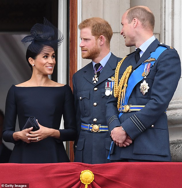 Harry and William speaking to Meghan in 2018 on the Buckingham Palace balcony