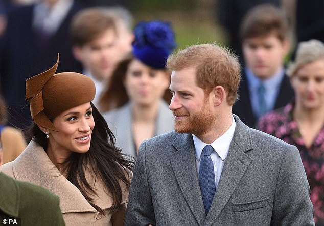 Meghan and Prince Harry are pictured in 2017 during their first Christmas as an engaged couple