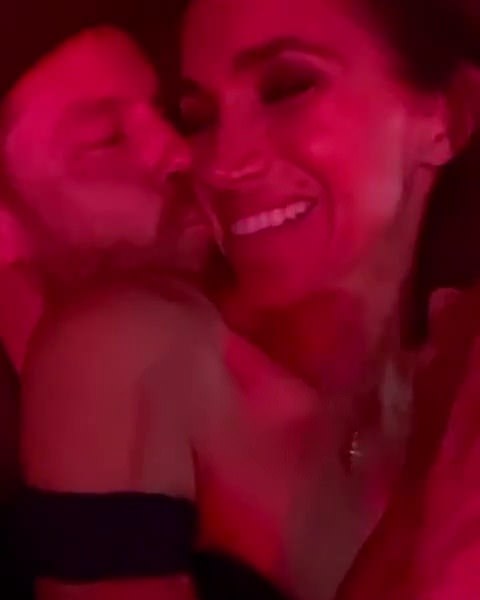 In one sweet clip, Prince Harry plants a kiss on his wife's cheek as they enjoy the show at SoFi Stadium in LA