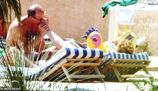 John Bryan (pictured) said in 2022 that the toe kissing was part of a game him and Sarah (pictured in 1992) were playing with Princesses Beatrice and Eugenie