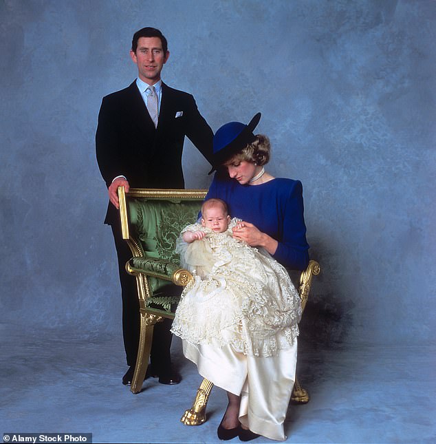 Prince Charles and Princess Diana pose with baby Harry at his christening in 1984