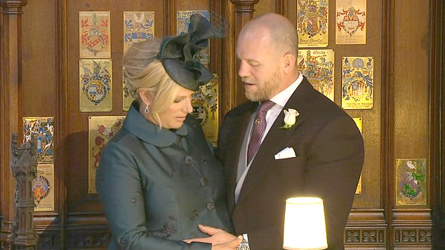 At one point Mike Tindall could be seen caressing his wife's bump - suggesting their unborn baby was making their presence felt at the special occasion with a well-timed kick or two