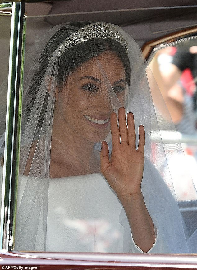 The royal wedding was certainly a first for the royal family and changed the precedent for what can be expected from future occasions. Meghan waves as she arrives at the ceremony