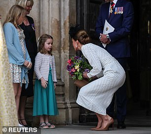 The Princess greeted two young girls with a handshake after the memorial service on Thursday