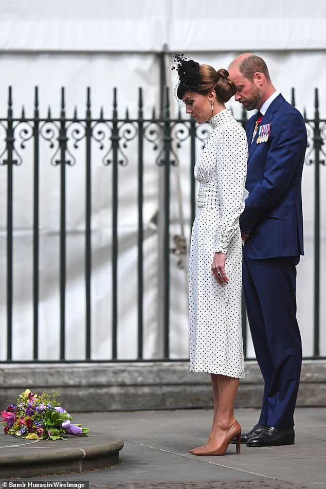 After laying their floral tributes, the Prince and Princess of Wales solemnly bowed their heads to pay their respects