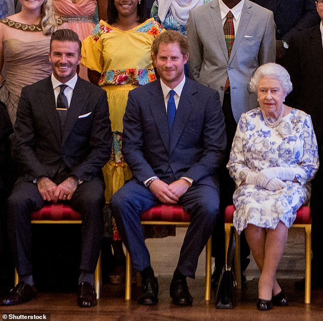 David Beckham, Prince Harry and Queen Elizabeth pose at the Young Leaders Awards at Buckingham Palace