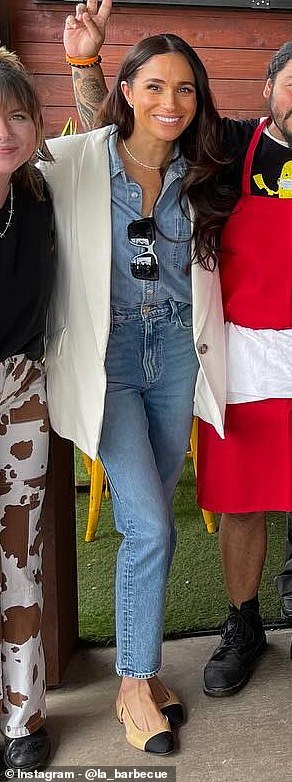 During a surprise visit to a Texas BBQ spot with Prince Harry last year, Meghan mastered the double denim look in an Aritzia shirt and slim-fit jeans, layered under a silk blazer by Heidi Merrick