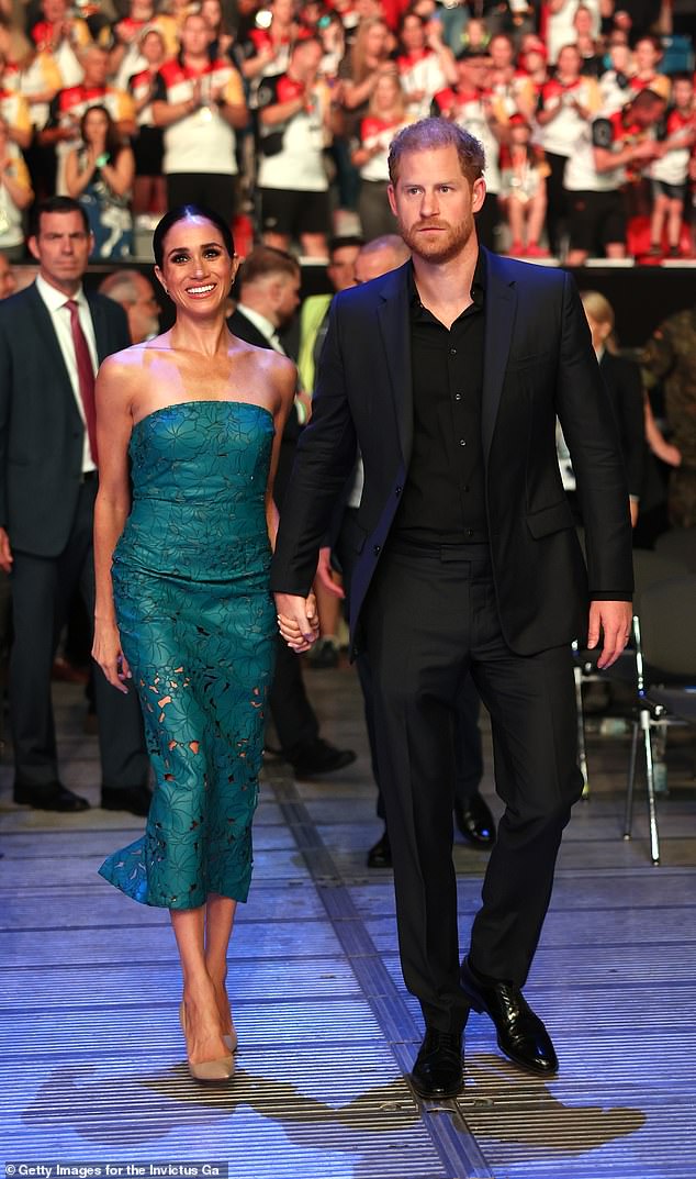 Meghan's peekaboo dress from Cult Gaia highlighted her décolletage, arms and flashes of leg, adding a tasteful edge to the ensemble