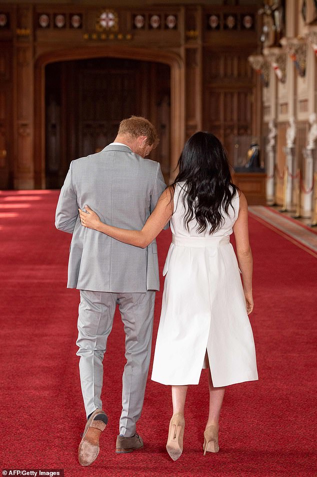 Harry, visibly overjoyed, carried his newborn son, while Meghan, glowing in a Grace Wales Bonner tuxedo dress, told the press: 'It's magic. It's pretty amazing. I have the two best guys in the world, so I'm really happy'