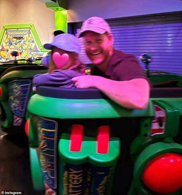 Harry flashed a cheerful smile as he turned towards the camera while sitting next to Lillibet on another ride