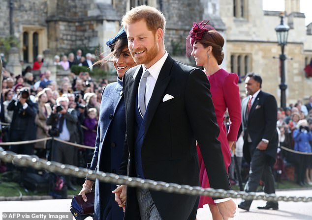 Harry is pictured here with his wife Meghan after attending the wedding of Princess Eugenie a and Jack Brooksbank at Windsor Castle in Berkshire in October 2018