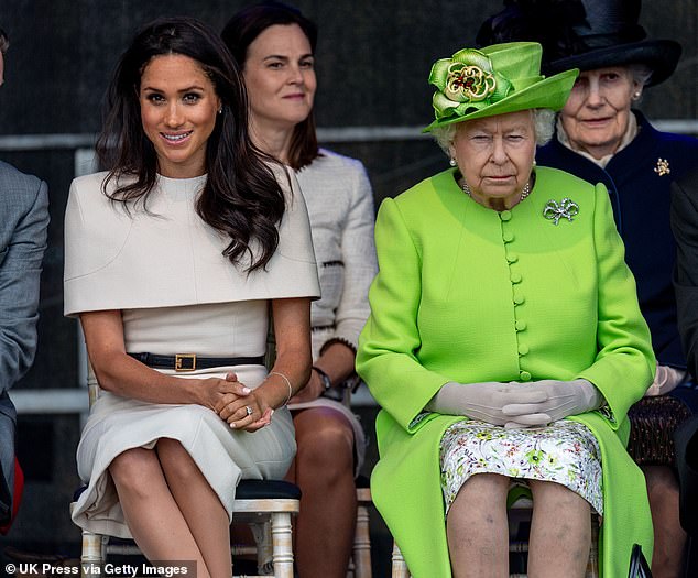 Meghan is seen here alongside the late Queen Elizabeth II at the Catalyst Museum in Widnes, Cheshire, in June 2018