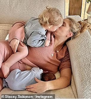 Stacey is pictured with her children at home