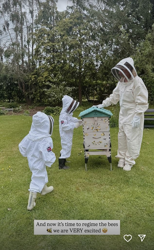 Stacey Solomon and her children tending to their bees in their garden
