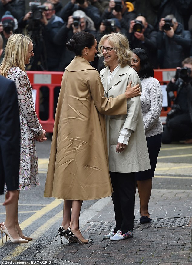 Meghan's £2,600 Oscar de la Renta coat was visibly crumpled as she stepped out of the car long before the engagement had even begun