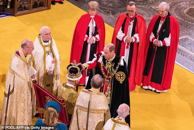 William touches the crown after pledging to be 'liege man of life and limb' for his father