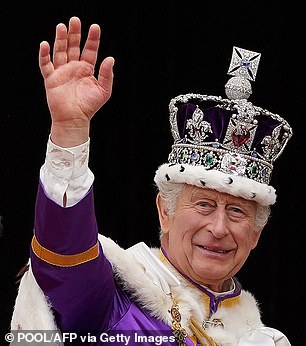 Newly crowned King Charles waves to the crowds from the Buckingham Palace balcony