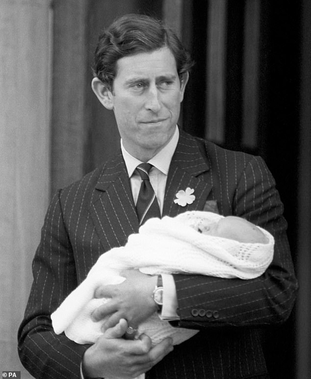 Prince Charles holds his first-born son Prince William as they leave St Mary's Hospital on June 22, 1982