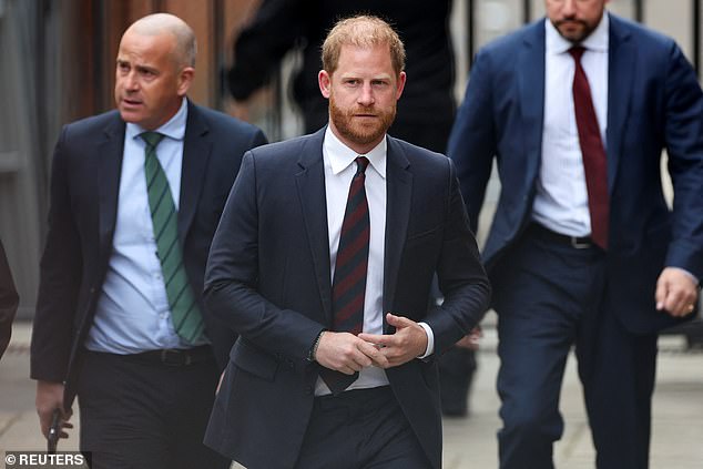 Britain's Prince Harry walks to attend court about his security issues on April 9