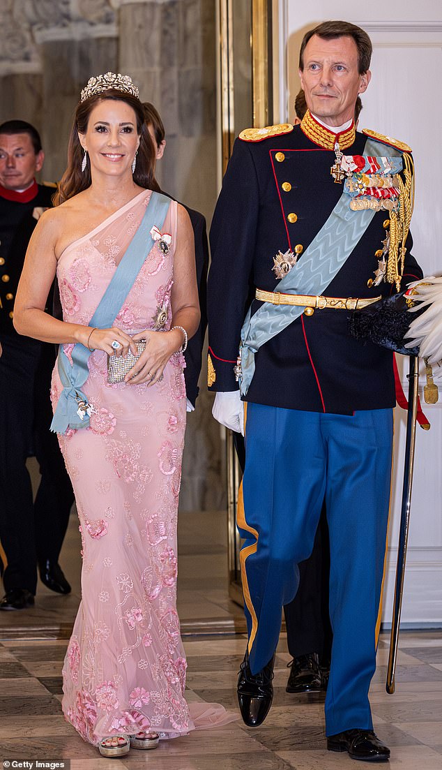 Prince Joachim and his wife Princess Marie, pictured here in 2023 attending a palace event, admitted to harbouring 'complicated' feelings after their children's royal titles were stripped