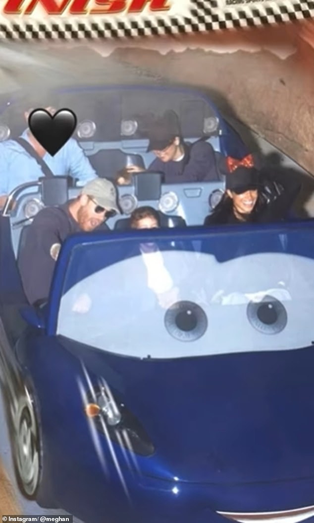 In a picture on the Cars Land ride, Meghan had obscured those sitting behind her by using black heart emojis to cover their faces
