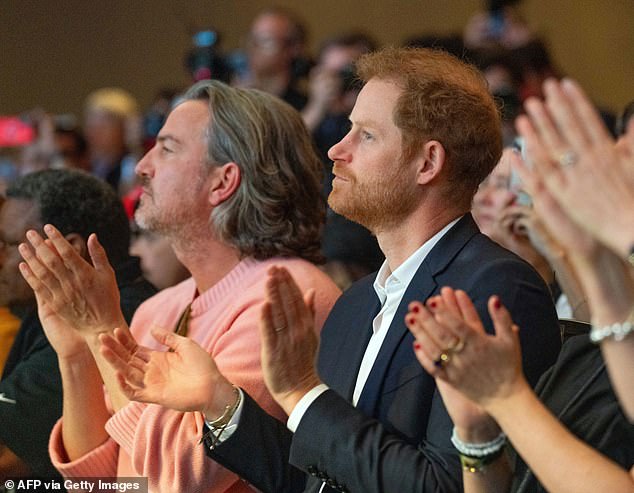Prince Harry sat next to Meghan Markle's old friend and confidante Markus Anderson in March last year