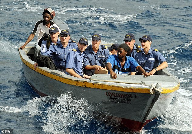 Prince William (centre) during a training exercise with the Royal Navy off the coast of Montserrat, a British overseas territory in the Caribbean
