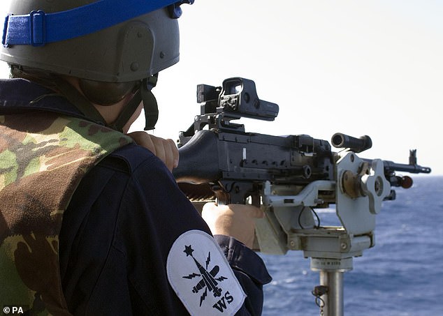 A member of HMS Iron Duke's ships company manning a general purpose machine gun during a drugs trafficking operation in the Caribbean. Adjusted for inflation, the seized drugs would now be worth over £60million